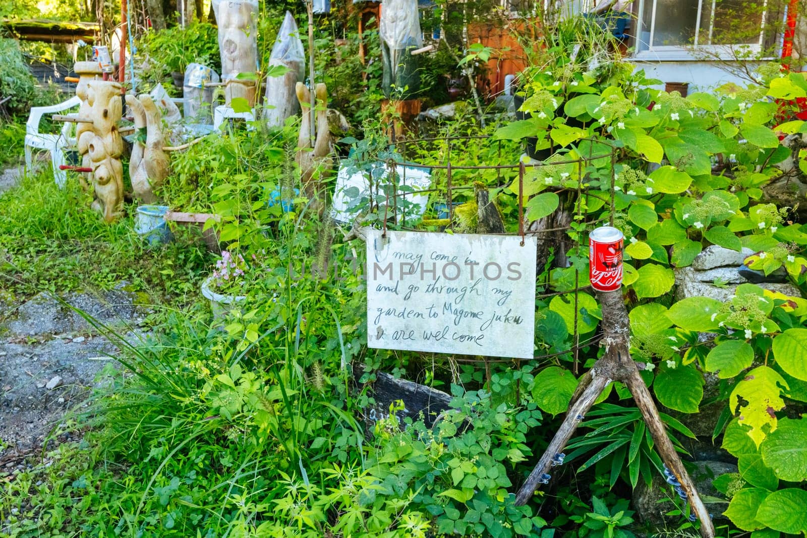 Hiking path garden on the famous Magome-Tsumago Trail as part of the Nakasendo Way between Magome and Tsumago in Gifu Prefecture, Japan