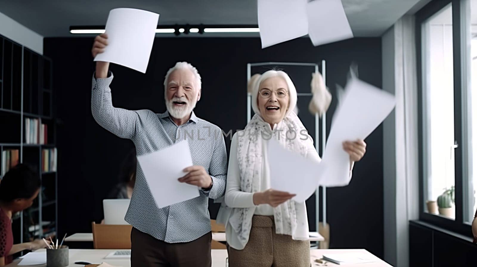 A man and a woman are joyfully throwing papers high up in the air, creating a cheerful and lively atmosphere all around them