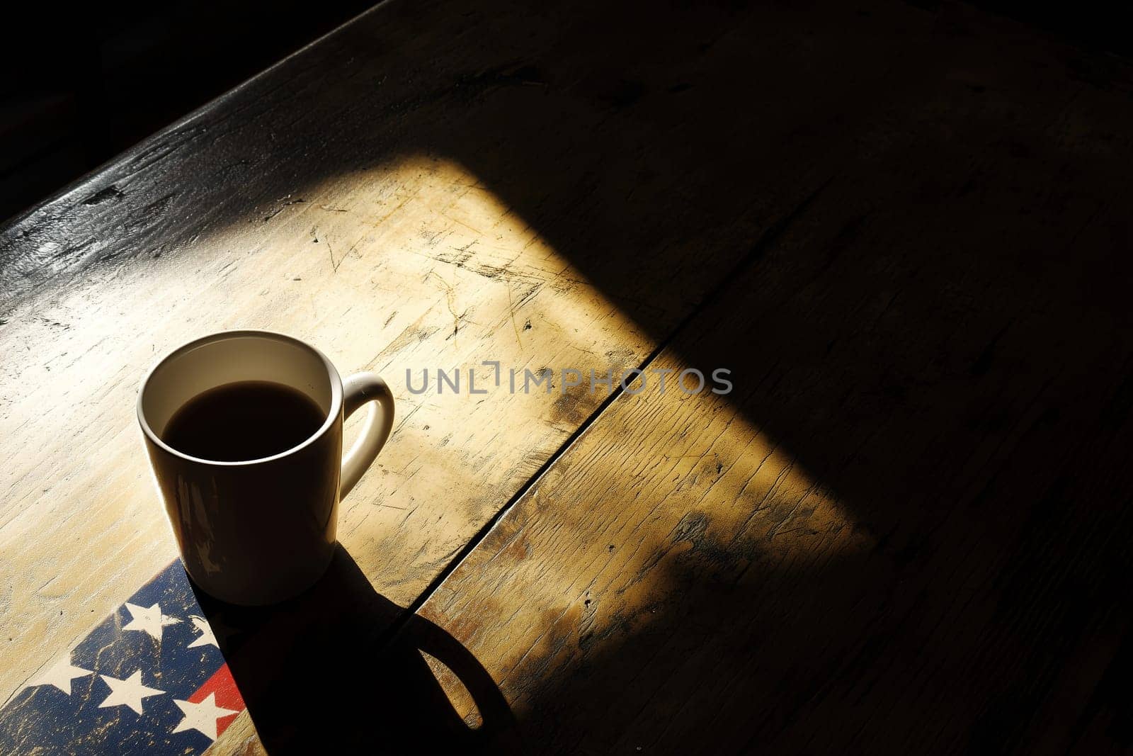 A solitary white mug filled with coffee sits on a weathered wooden table. Soft morning light creates striking shadows, enhancing the cozy atmosphere of the café.