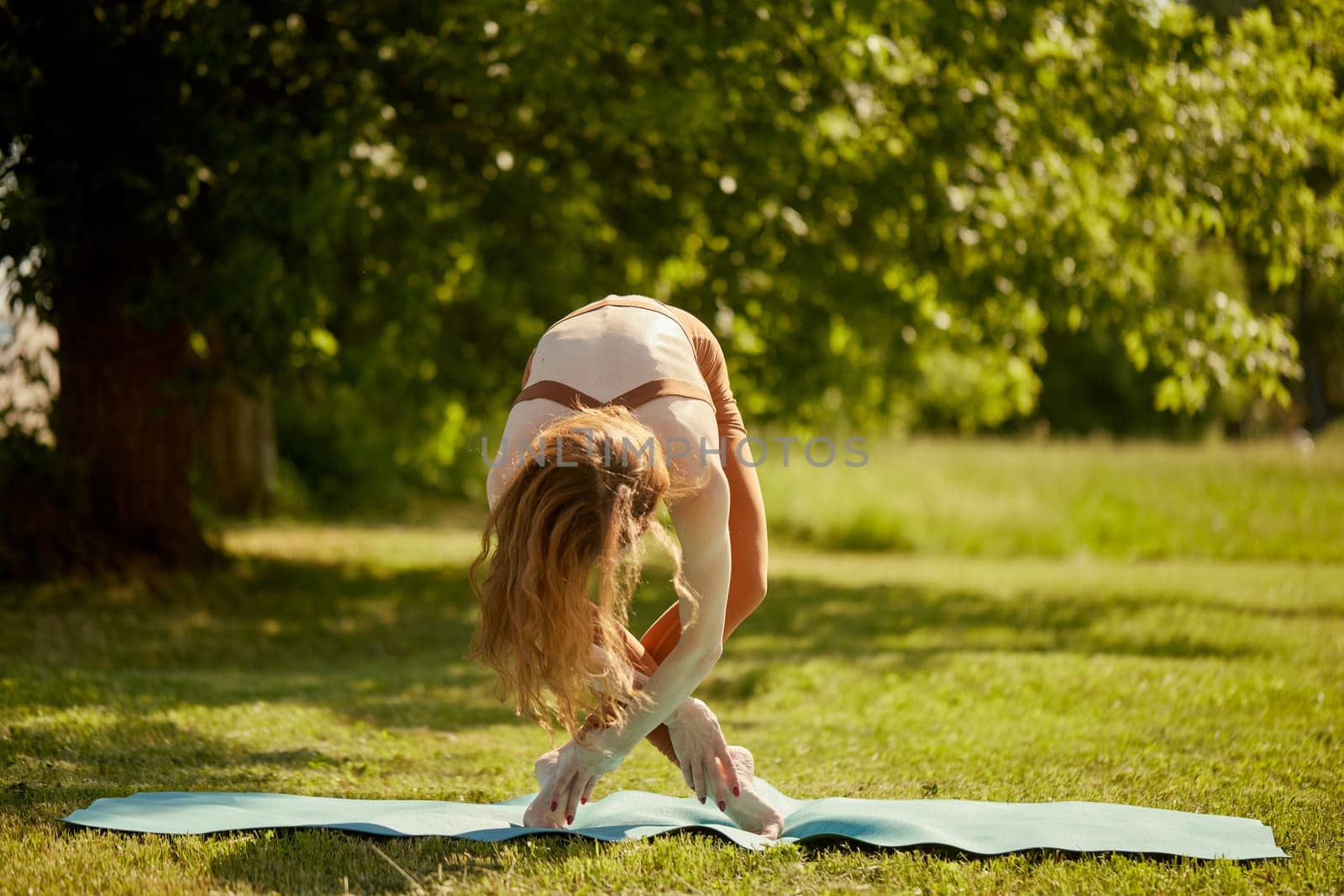 young girl doing yoga in nature, Asanas - poses in yoga for beginners, outdoor workout concept
