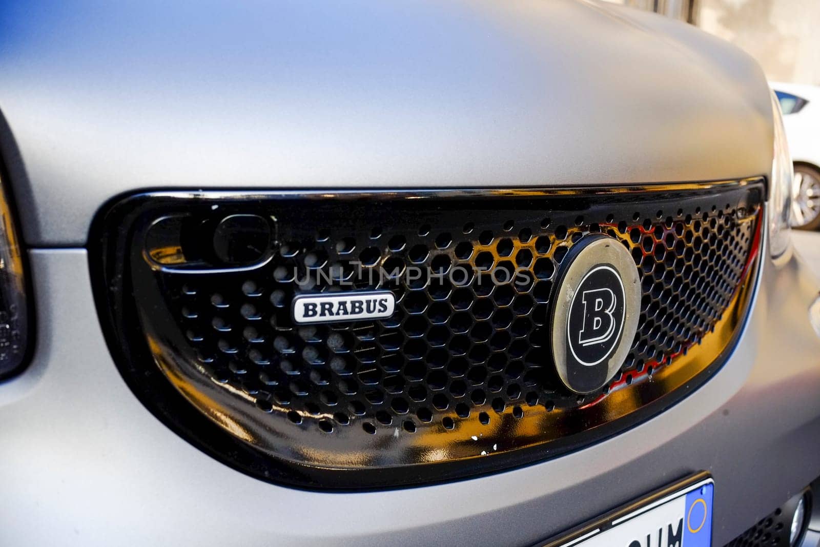 Cremona, Lombardy, Italy - November 7th 2024 Close-up of brabus logo on the customized front grille of a smart car, showcasing luxury tuning