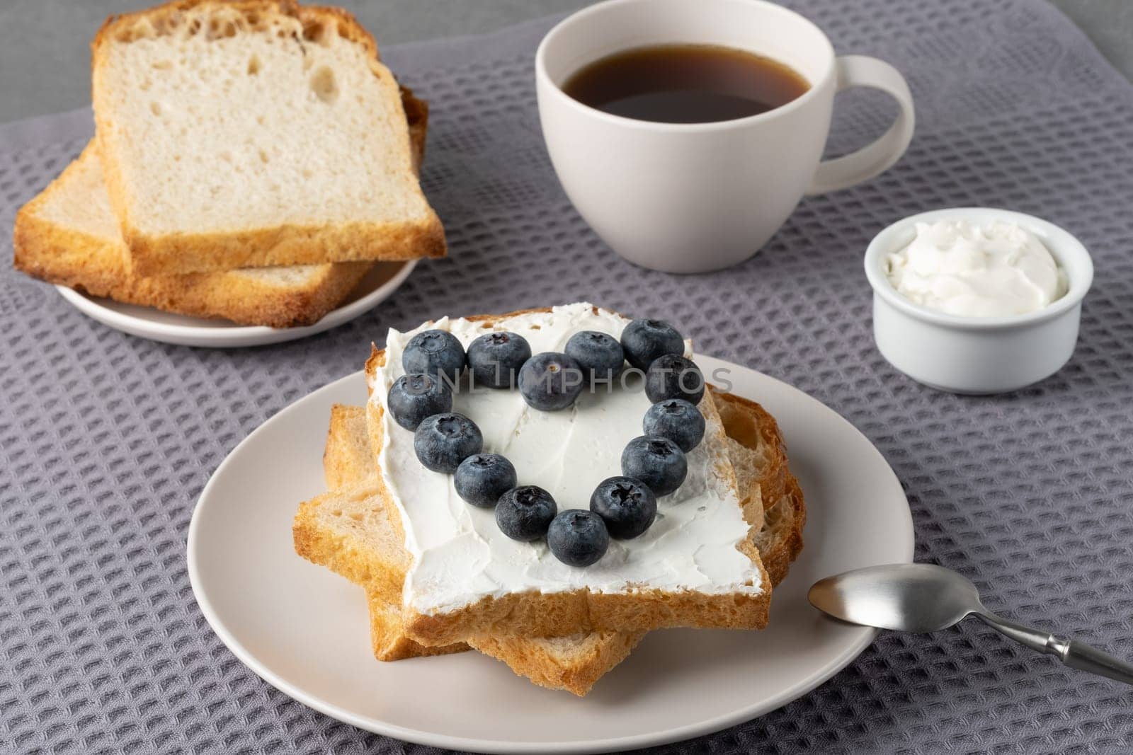Sandwich with cream cheese and blueberries.