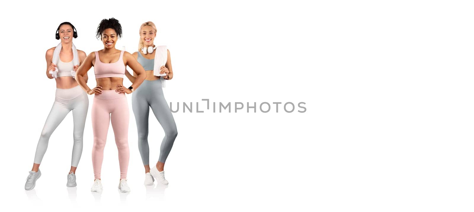 Three women are engaging in fitness activities, wearing colorful activewear and showing enthusiasm for health. They hold water bottles and appear motivated in their workout routines.