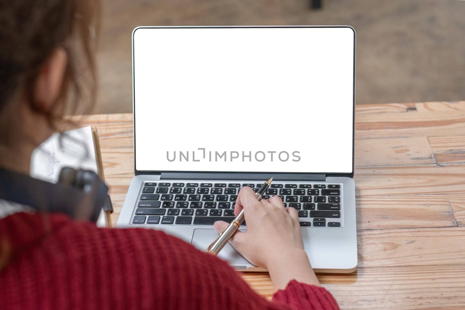 Image of female hand using and touching on laptop touchpad with blank white desktop screen. by wichayada