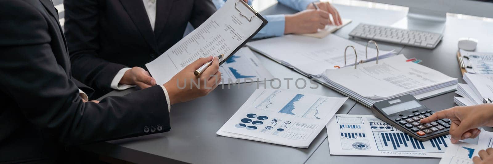 Auditor team collaborate in office, analyzing financial data and accounting record. Expertise in finance and taxation with accurate report and planning for company revenue, expense and budget. Insight