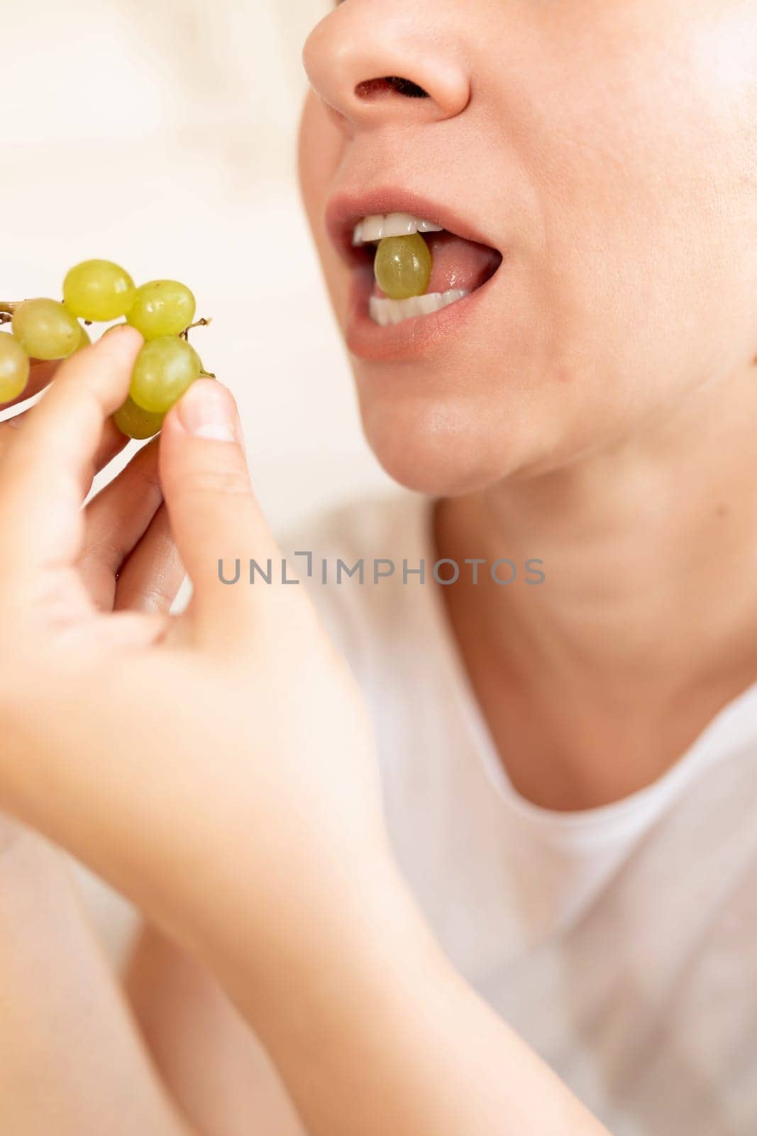 young woman overeats on fruit while dieting.