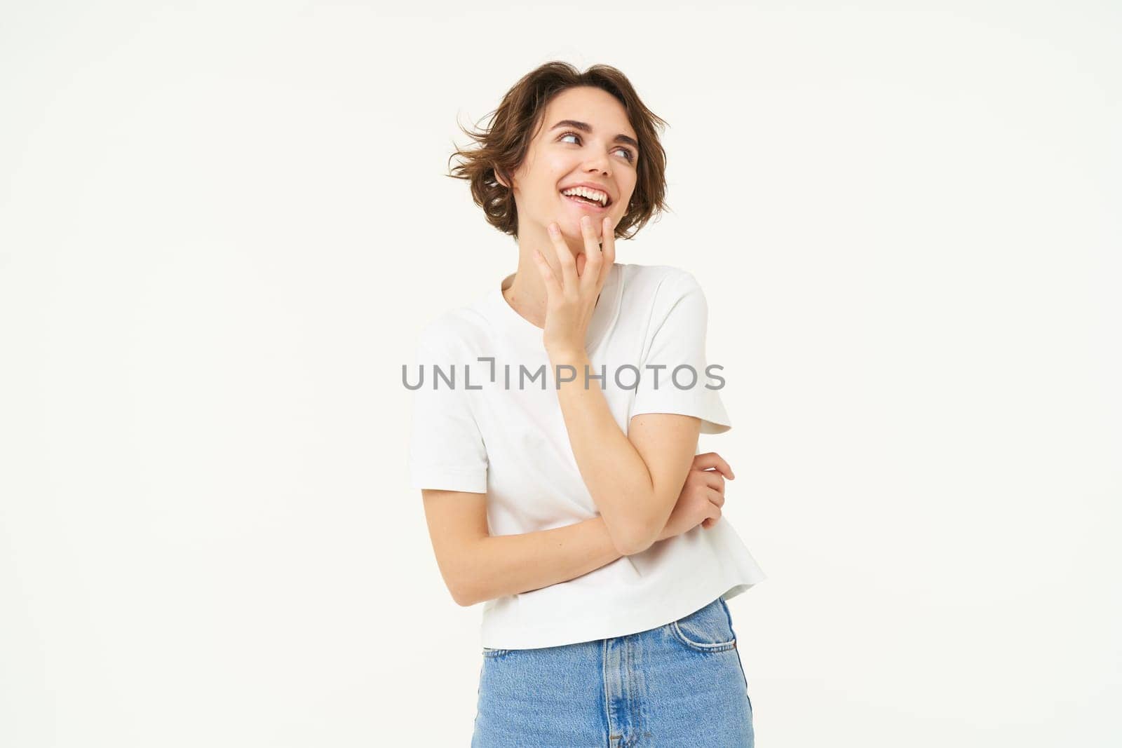 Portrait of carefree girl, gentle and feminine woman with short hair, laughing, posing over white studio background by Benzoix