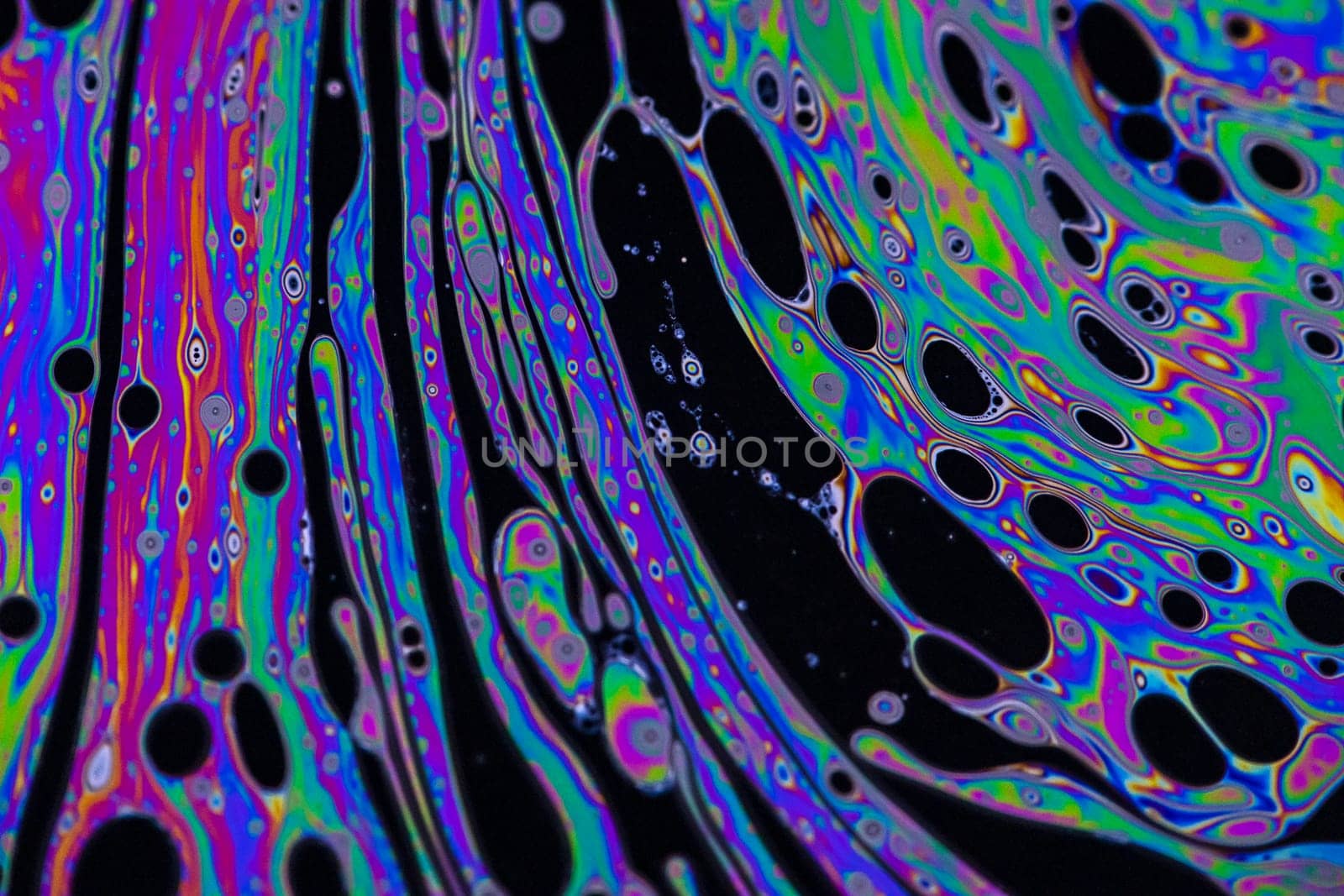 Macro photo of colourful pastel swirly patterns of a soap bubble by StefanMal