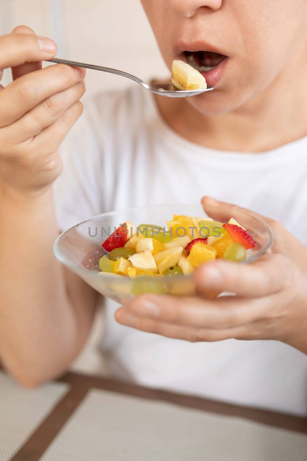 young woman overeats on fruit while dieting by TRMK