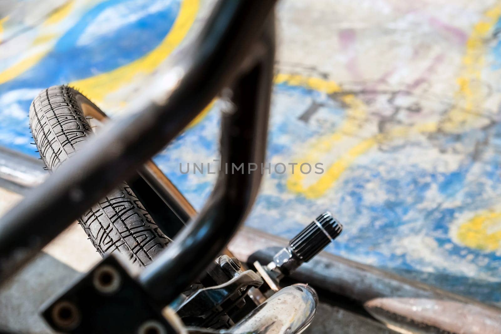 Close up of bmx bike on a ramp in a skatepark, BMX concept.