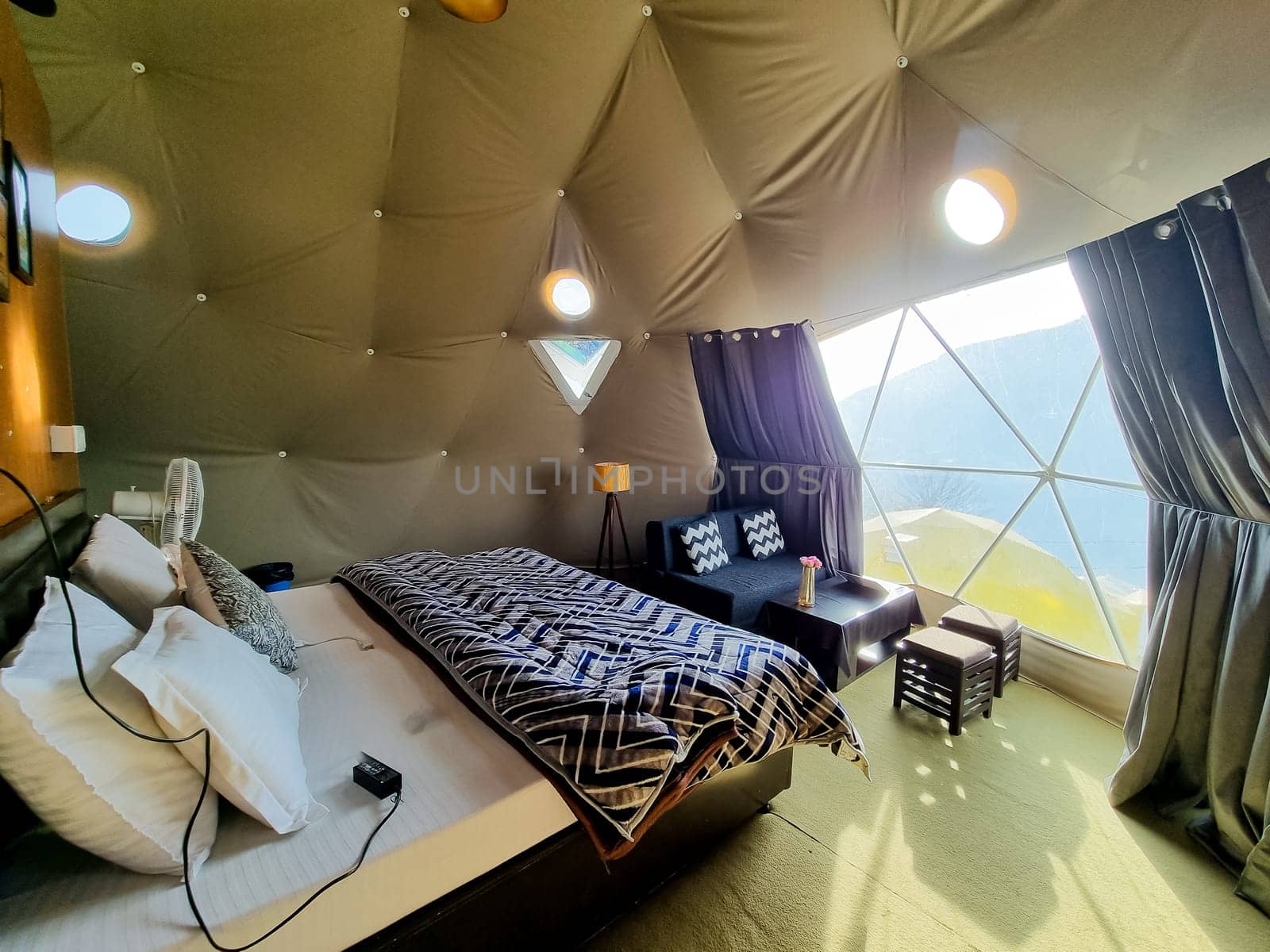 Interior of geodesic, triangular and swiss tents at a popular glamping spot near hampta village manali for eco freindly and comfortable adventure stays in India