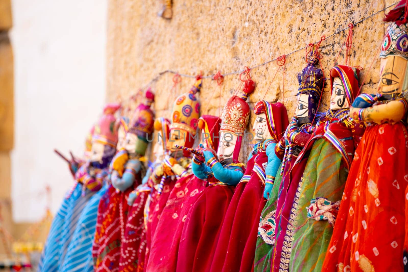 Colorful rajasthani puppets hand made and painted used as decorations or theater props in plays very popular in Jodhpur, Jaisalmer and across Rajasthan
