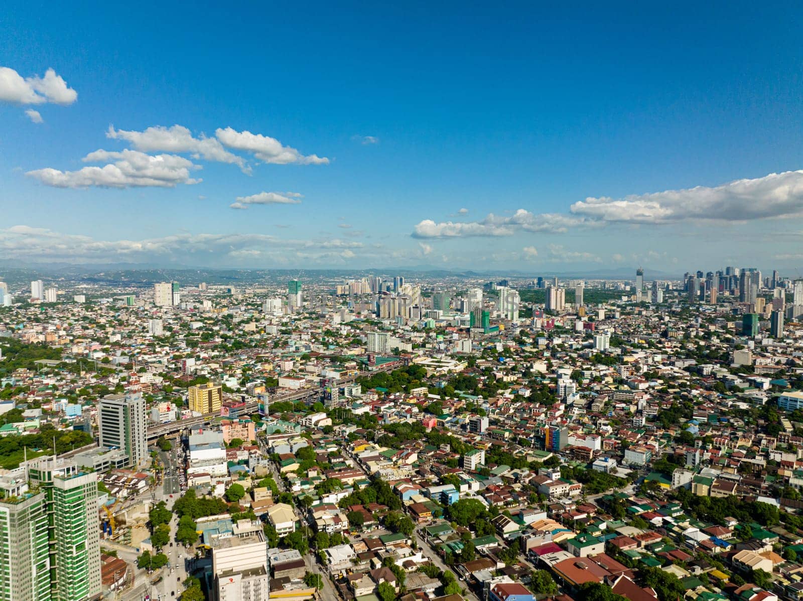 Aerial drone of Manila is the capital of the Philippines with modern buildings and skyscrapers.