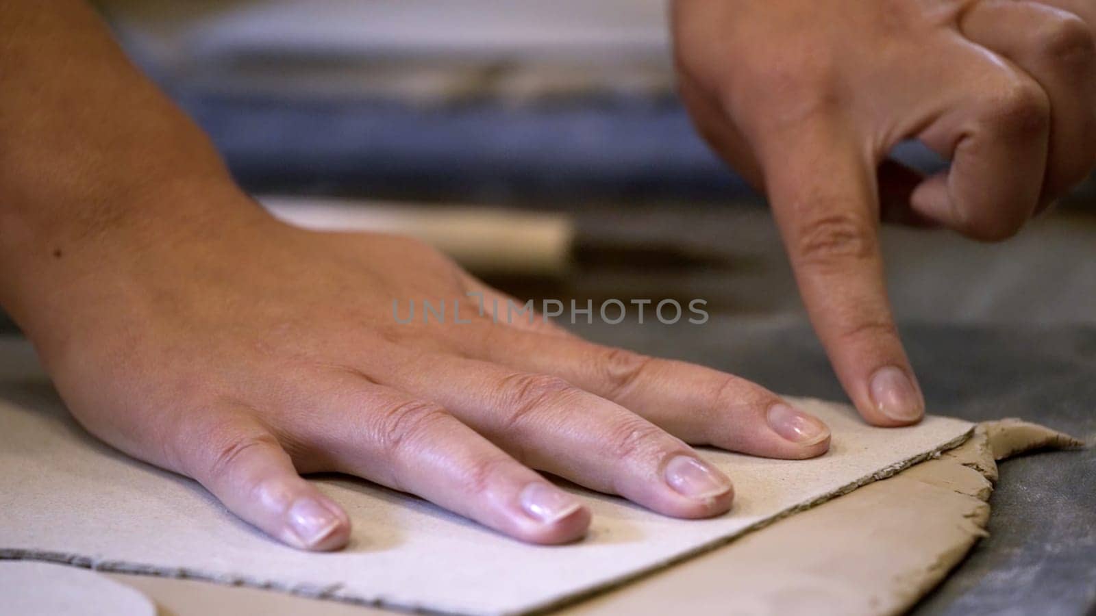 Hands skillfully shaping soft clay, showcasing unique artistry and fine craftsmanship in the art of pottery making. Stock Clip