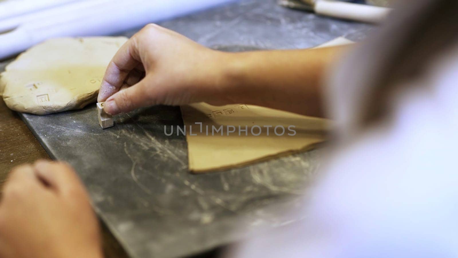 Artisan Hands at Work Passionately Crafting Beautiful Creations with Clay and Careful Precision. Stock Clip