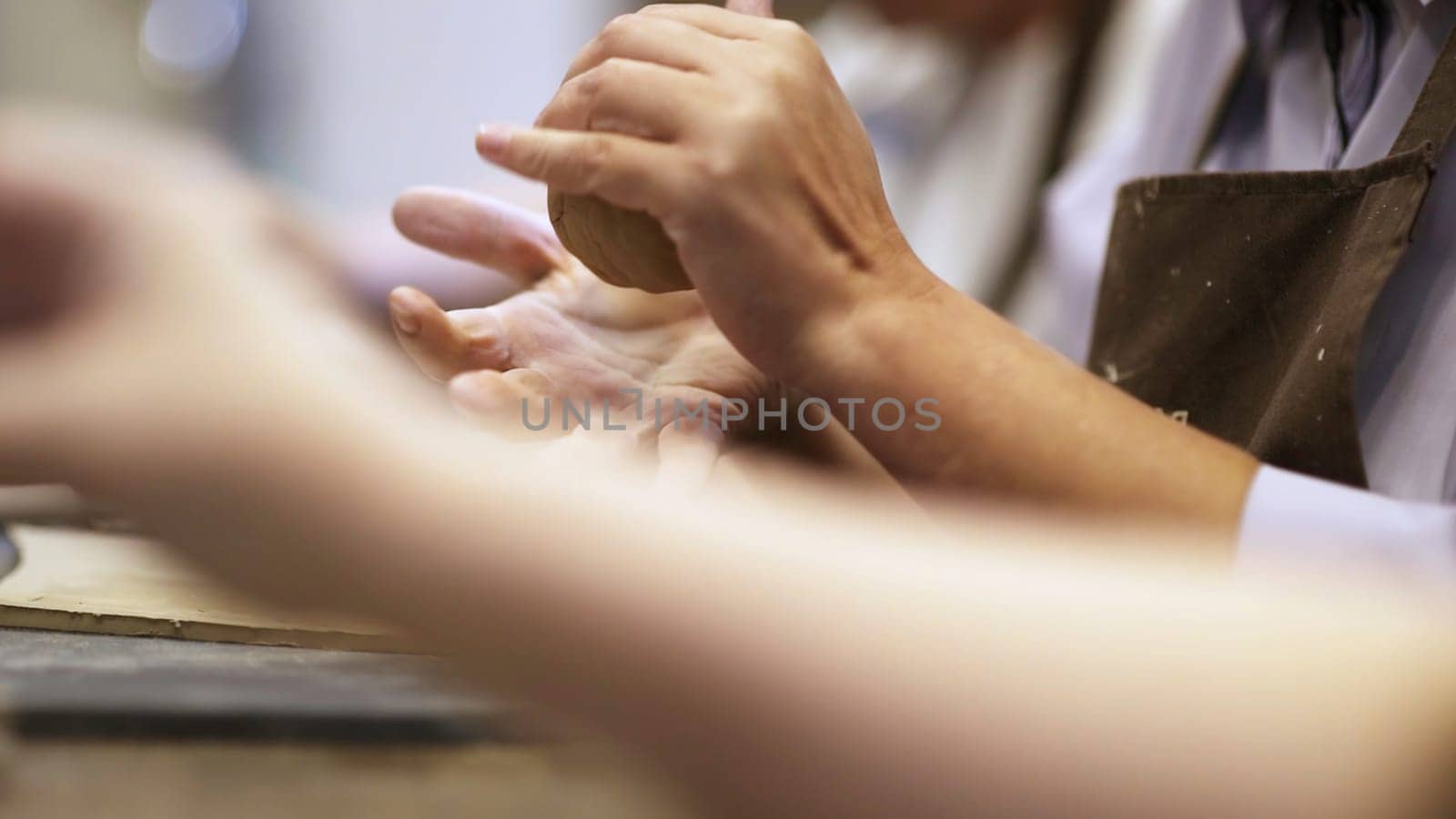 A closeup view of skilled hands meticulously engaged in creative crafting, showcasing the true art of craftsmanship. Stock Clip