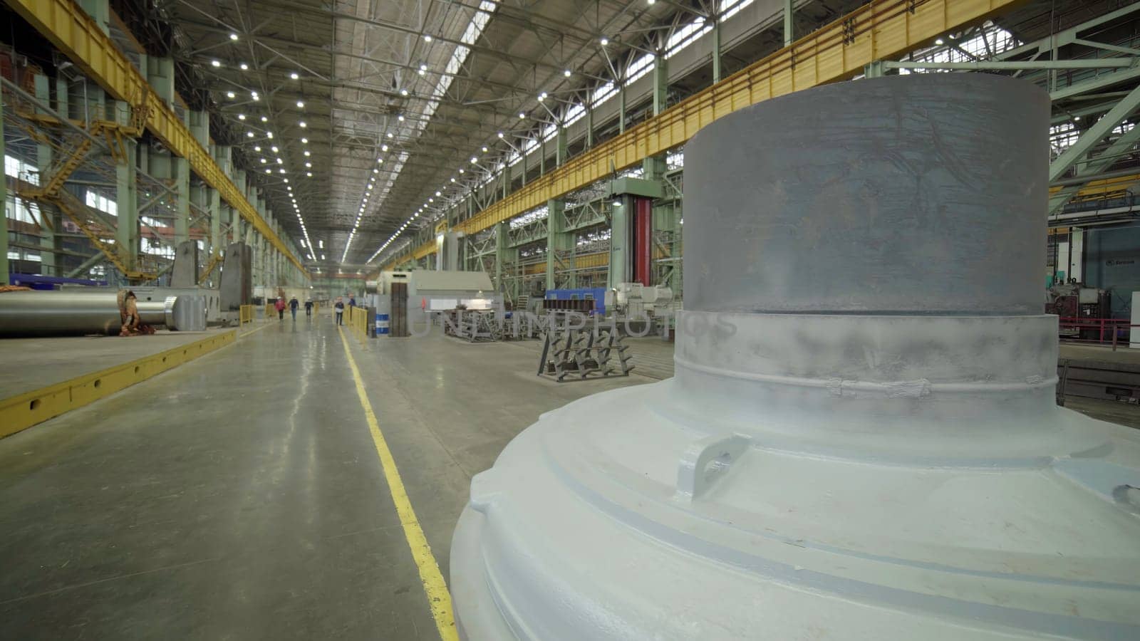 A wide view of an expansive industrial manufacturing facility filled with various machinery and equipment. Stock Clip
