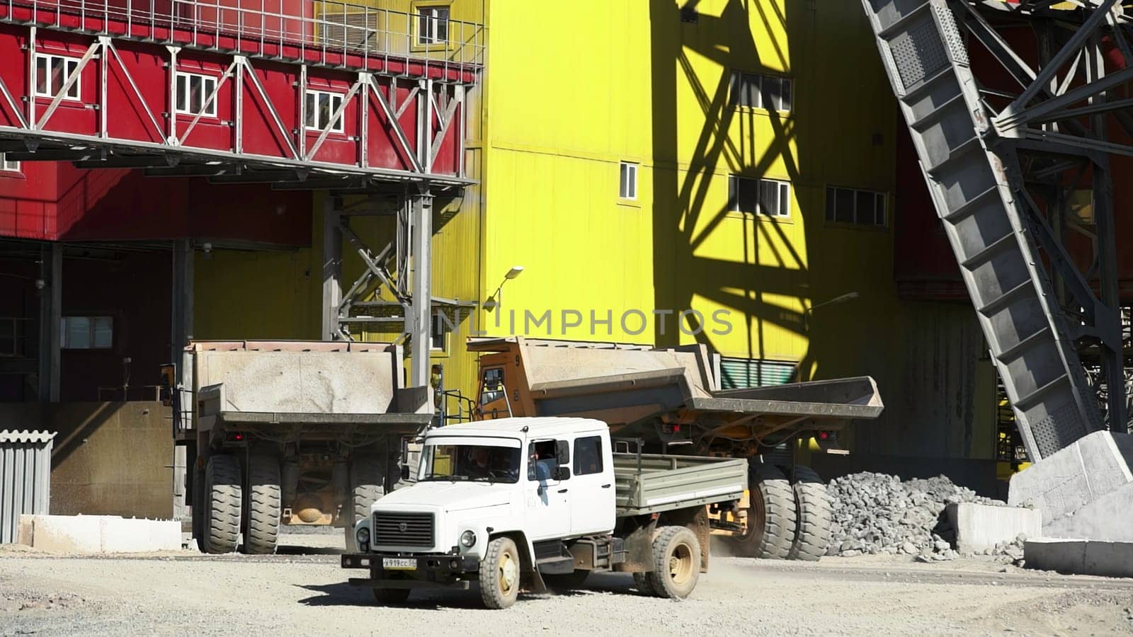 Tbilisi, Georgia - August 02, 2024: A lively and bustling construction site is vividly displaying dump trucks and heavy machinery actively working. Stock Clip