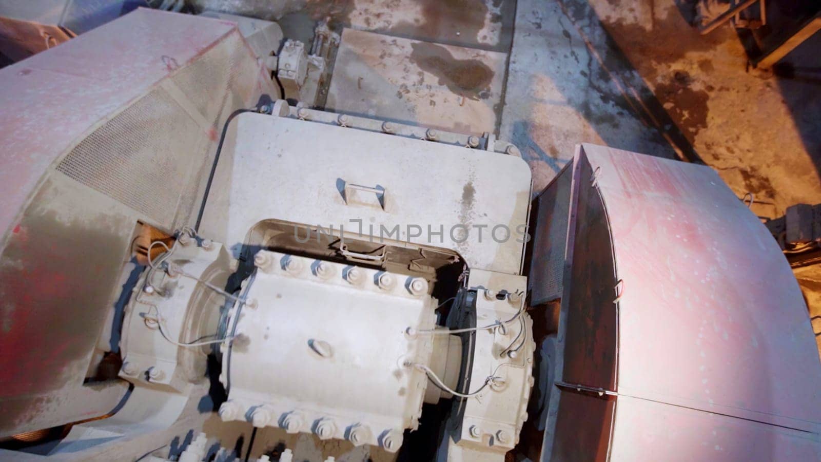 Detailed view of a machinery component in an industrial setting, showcasing functionality and design. Stock Clip