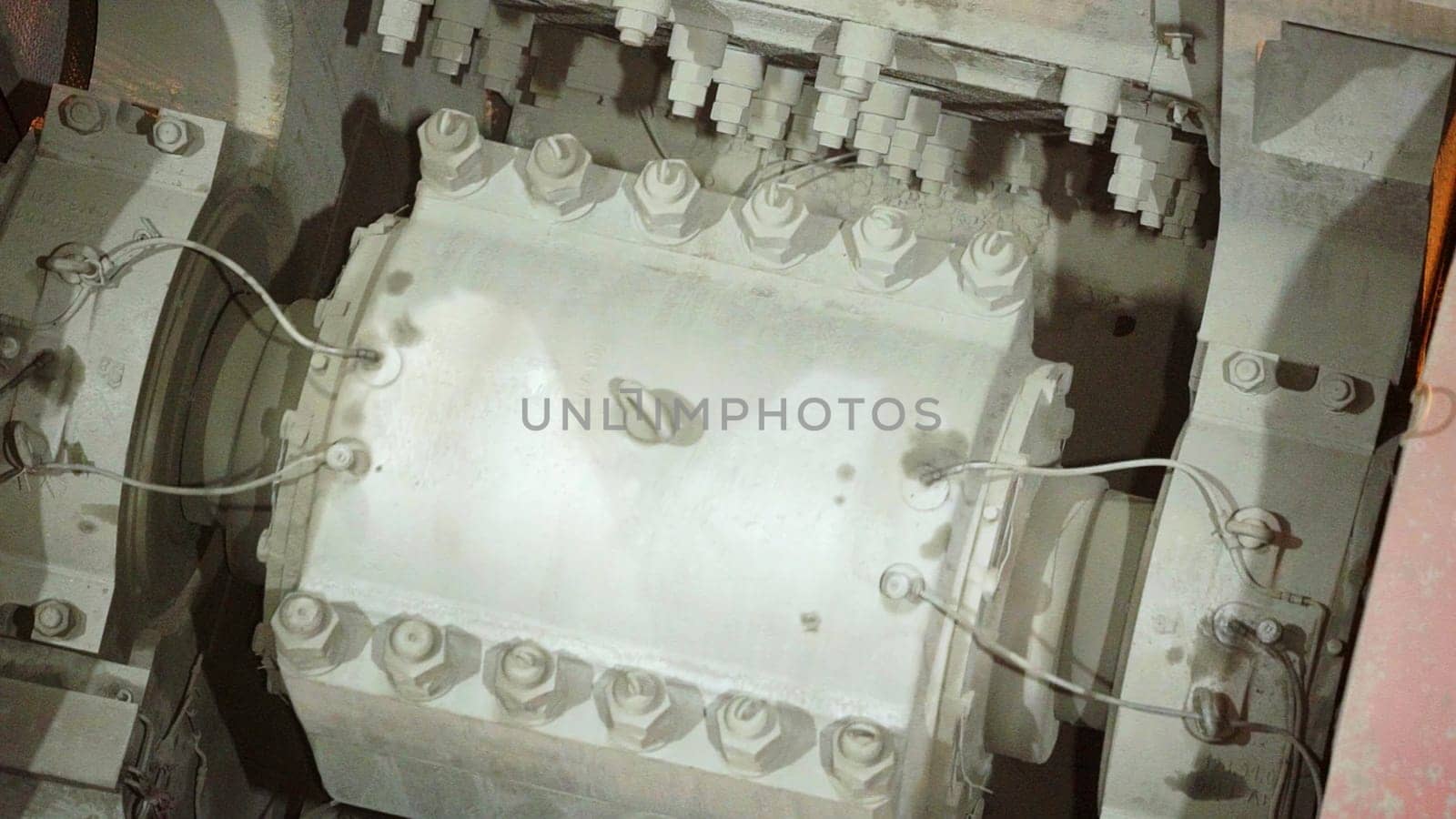 A detailed close up view of a complex industrial machine component showcasing its various intricate elements clearly. Stock Clip
