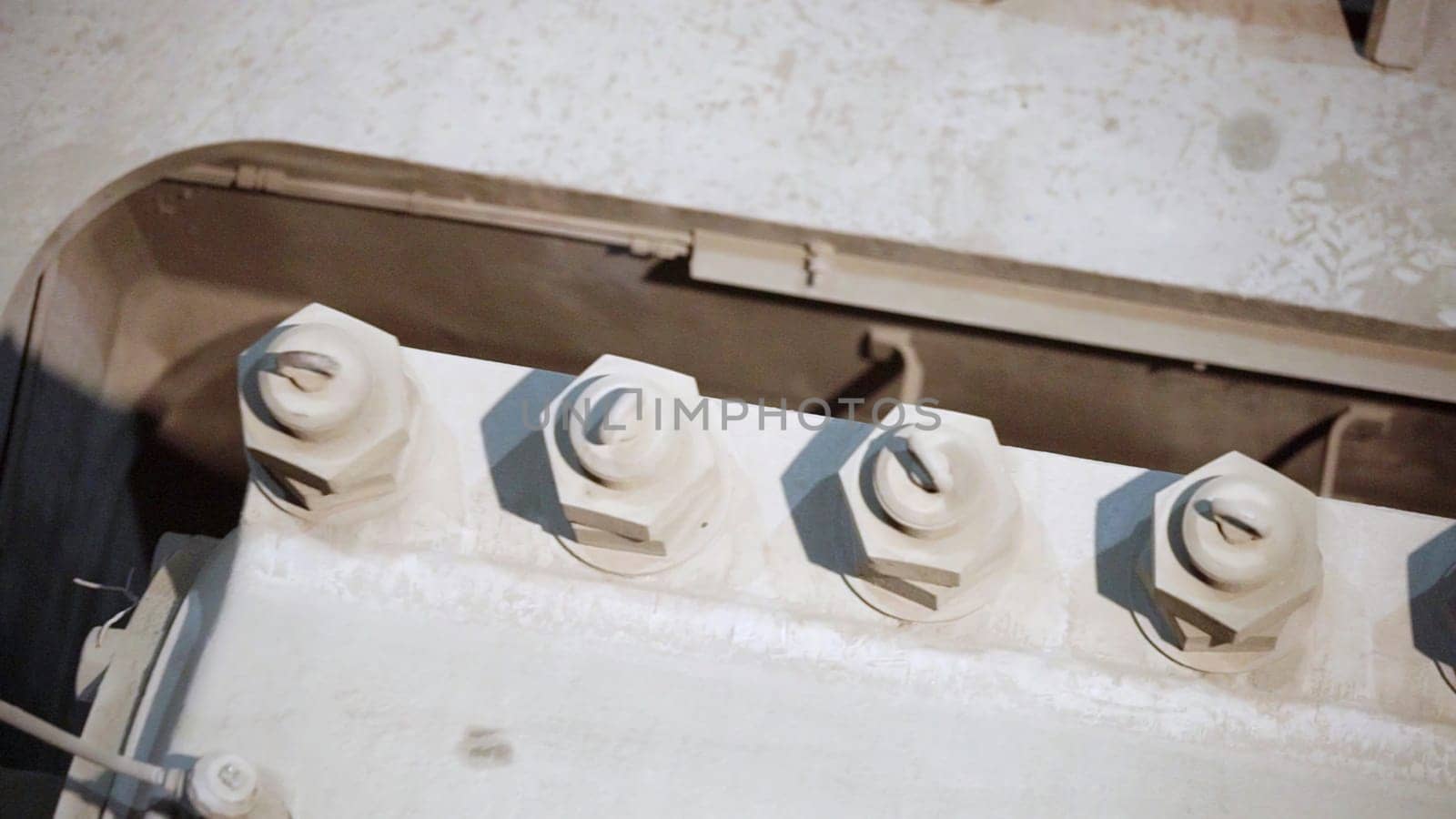 The image shows a closeup of a component in industrial machinery, highlighting its intricate features. Stock Clip