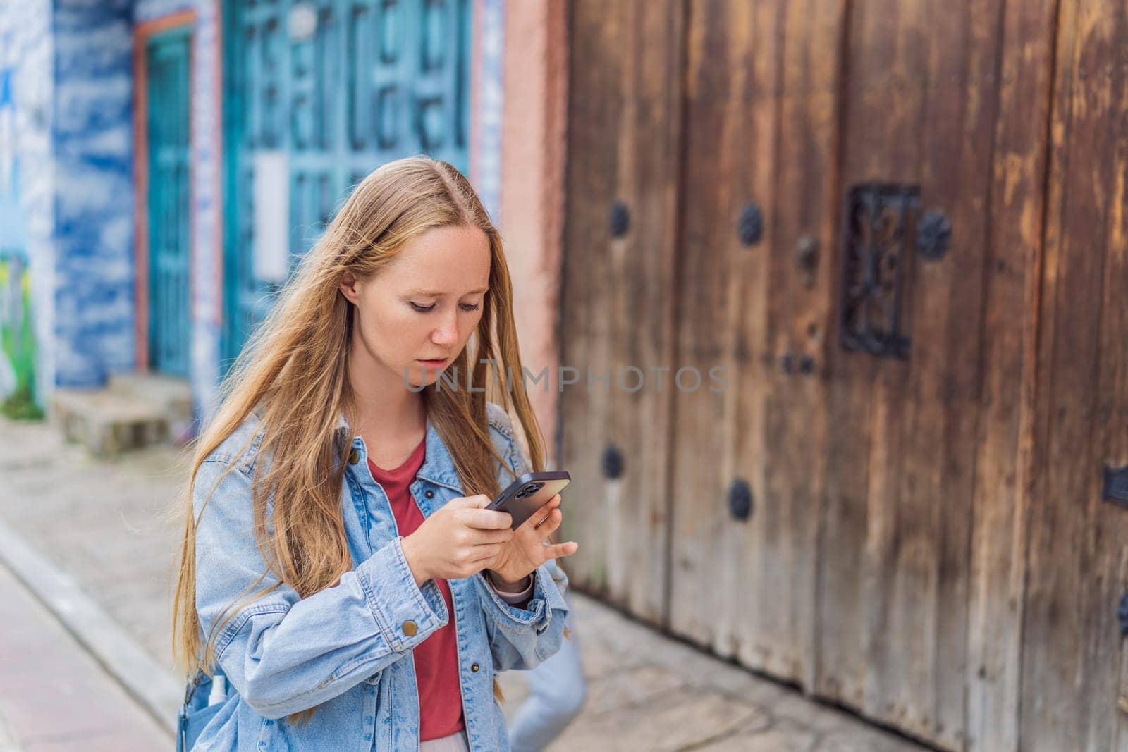 Female tourist walks through the colonial streets San Cristobal de las Casas, Mexico. Cultural exploration, architecture, and travel experience concept.