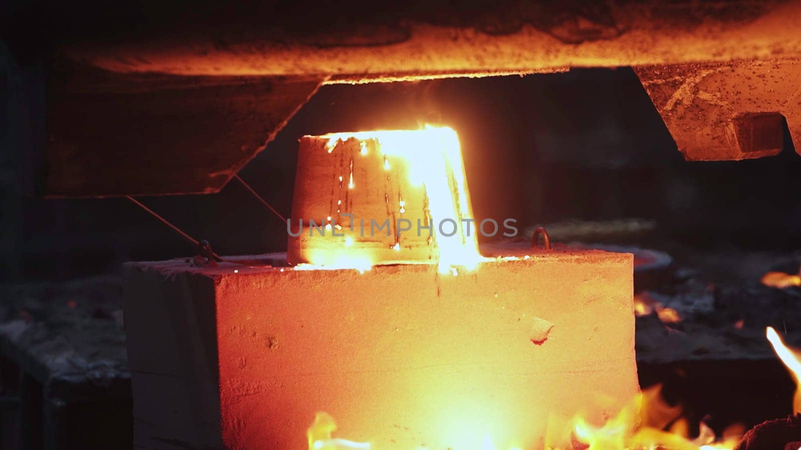 A captivating and mesmerizing display of molten metal being expertly cast, showcasing intense heat and dynamic sparks. Stock Clip