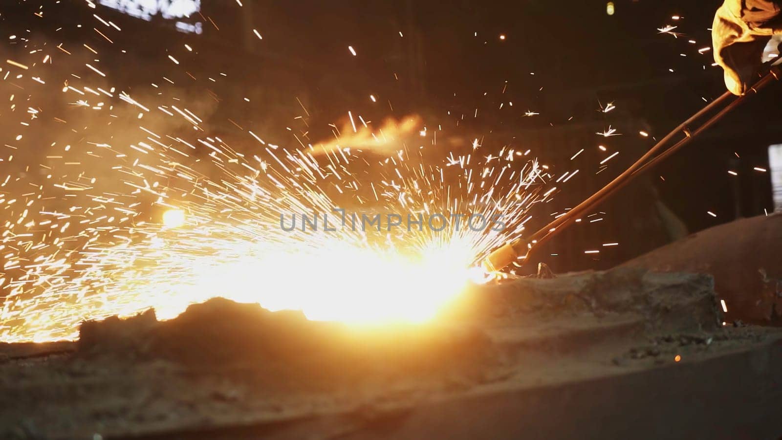 A captivating view of the fascinating process of metalworking, showcasing vibrant sparks and intense heat. Stock Clip