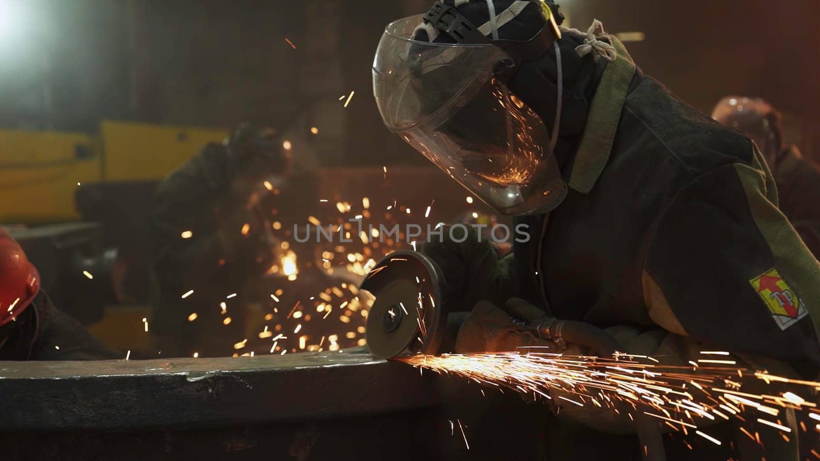 A skilled worker engages in metalworking, showcasing sparks and craftsmanship in a dynamic environment. Stock Clip
