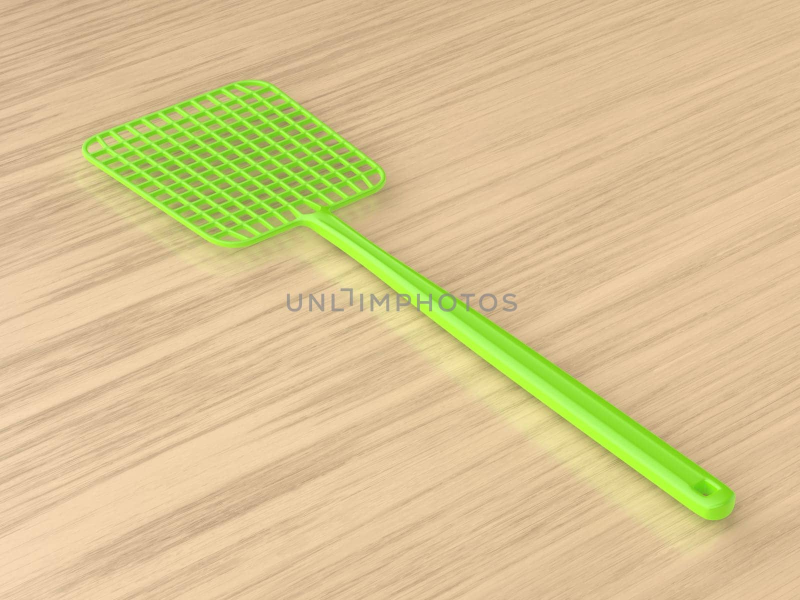 Green fly swatter on a wooden table