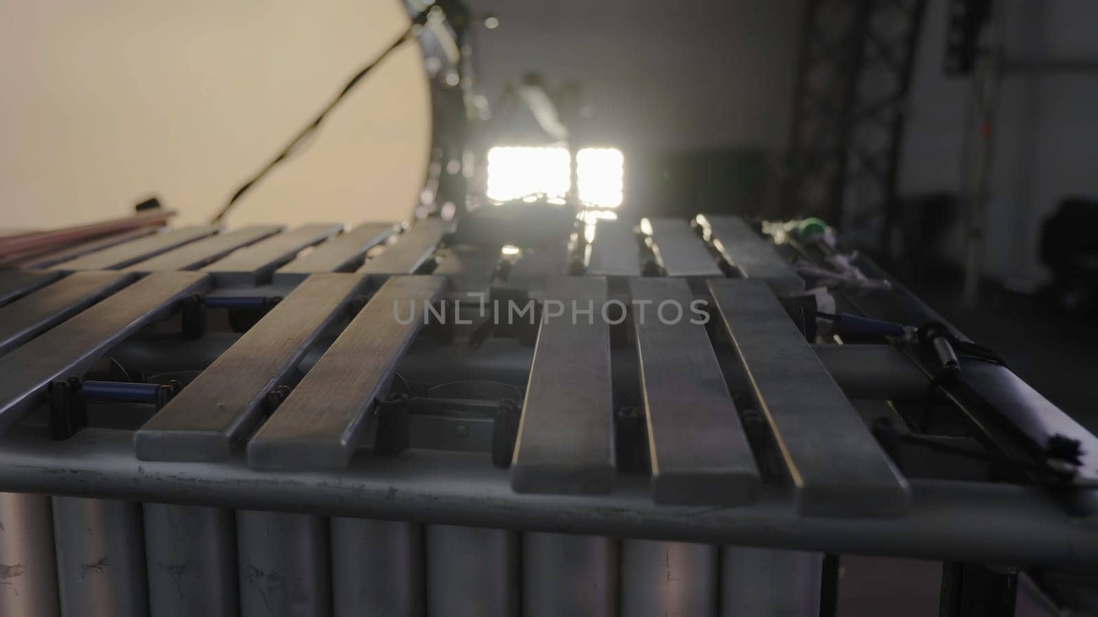 An intricate and detailed view of metallic xylophone bars, beautifully showcasing artistic lighting and setup. Clip