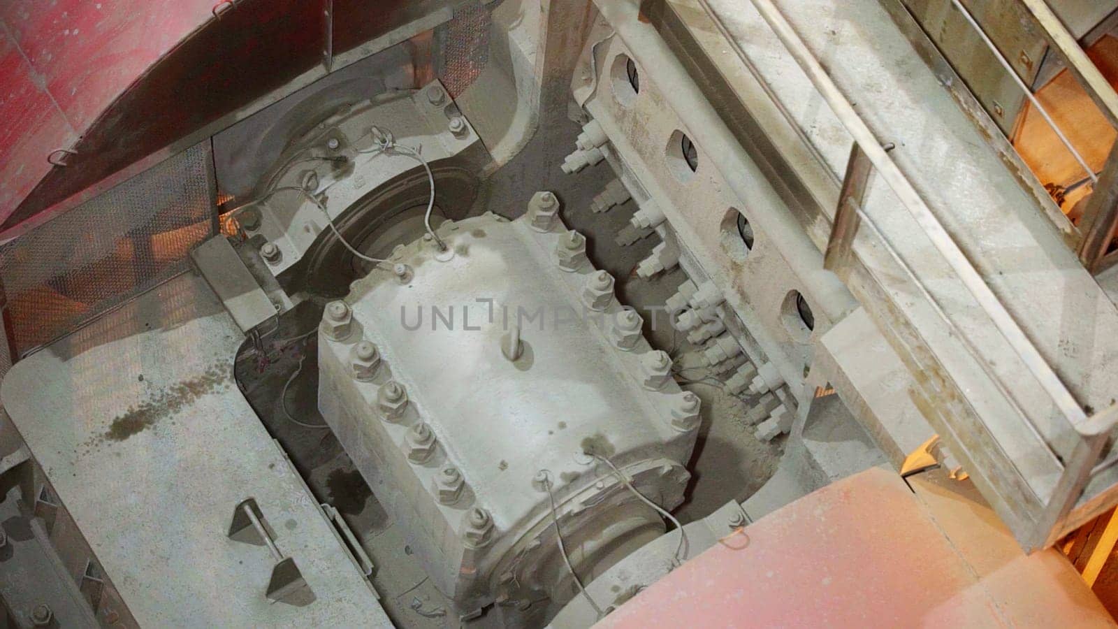 A topdown view of complex machinery showing interconnected gears and essential components in operation. Stock Clip