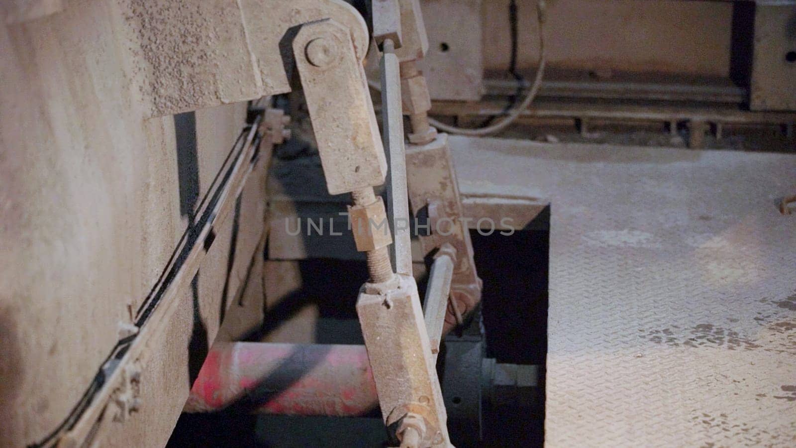 Close up of industrial machinery, highlighting hydraulic mechanisms and operational components in the processes. Stock Clip