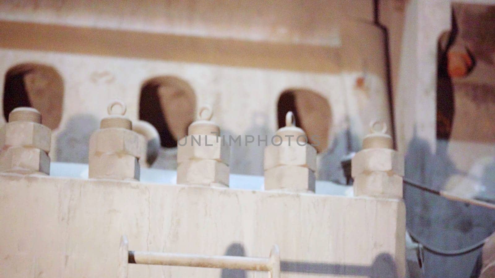 Close up of various industrial connectors and fasteners on heavy machinery, showcasing detail and complexity. Stock Clip