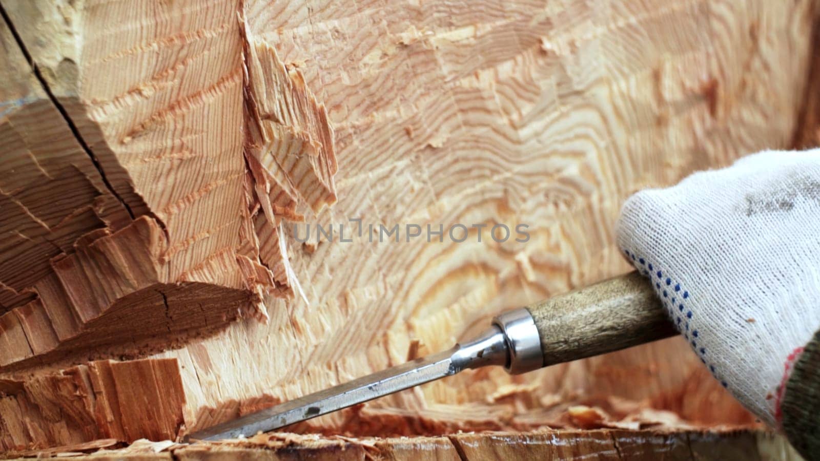 A detailed look at wood carving that showcases exceptional craftsmanship and intricate wood textures with various tools. Stock Clip