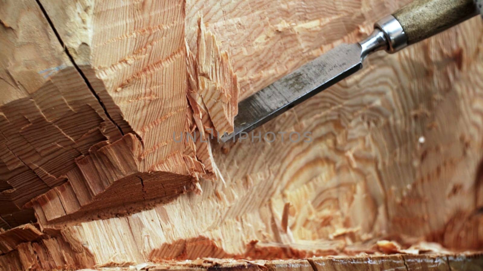 A detailed look at wood carving that showcases exceptional craftsmanship and intricate wood textures with various tools. Stock Clip