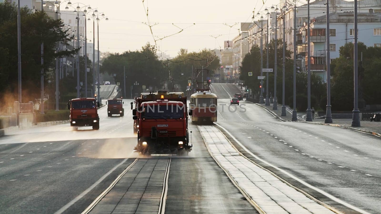 Tbilisi, Georgia - September 29, 2023: A peaceful and serene morning view featuring trams and various vehicles bustling in a busy city street scene. Stock Clip