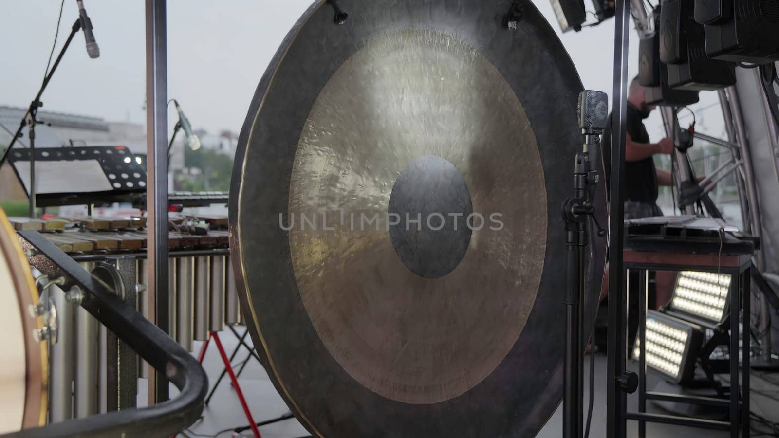 A closeup view of a large, intricate gong ready for an exciting live performance at a memorable event. Clip