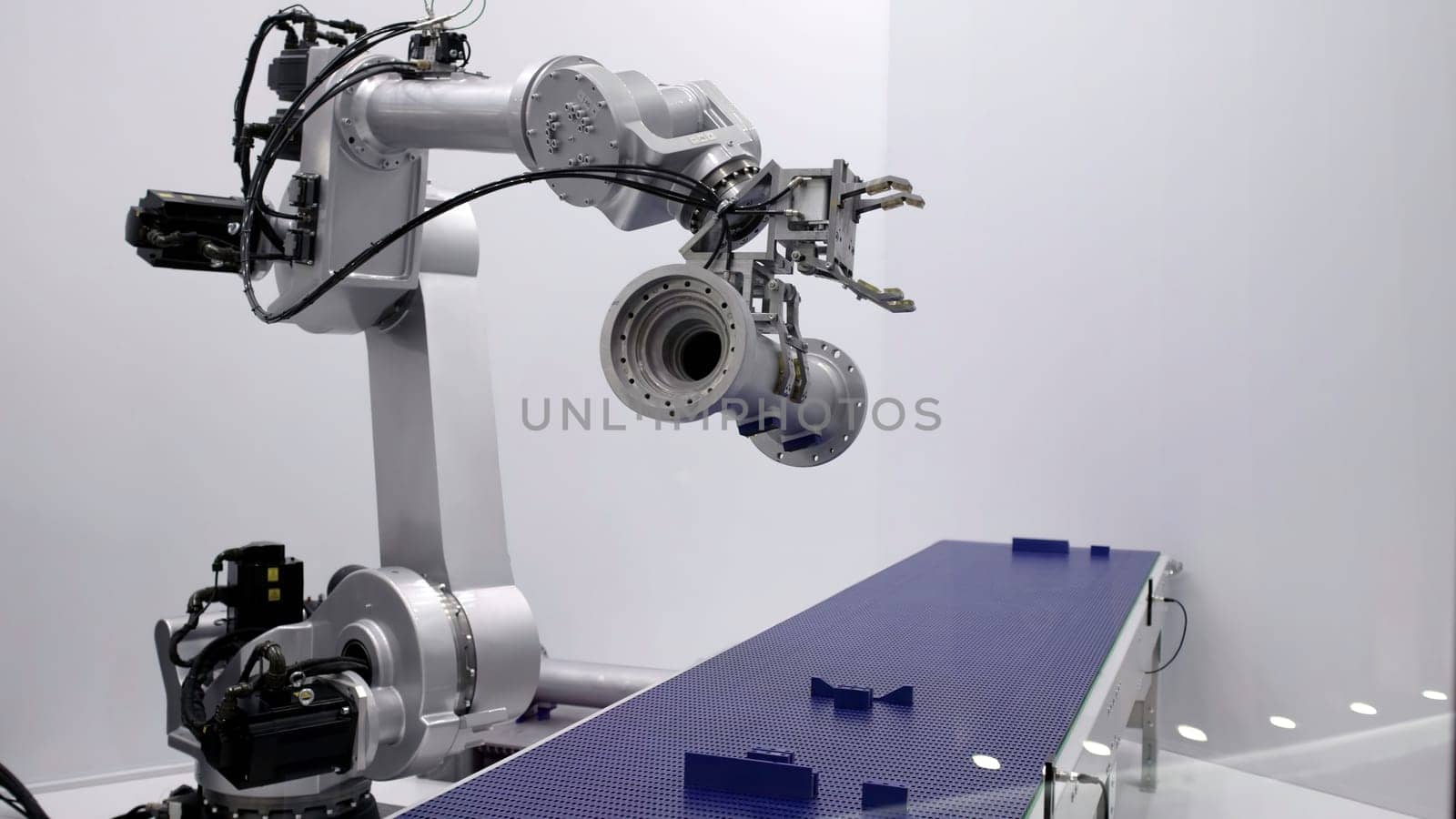 An innovative robotic arm was demonstrated in a sleek manufacturing setup designed for automation processes. Media