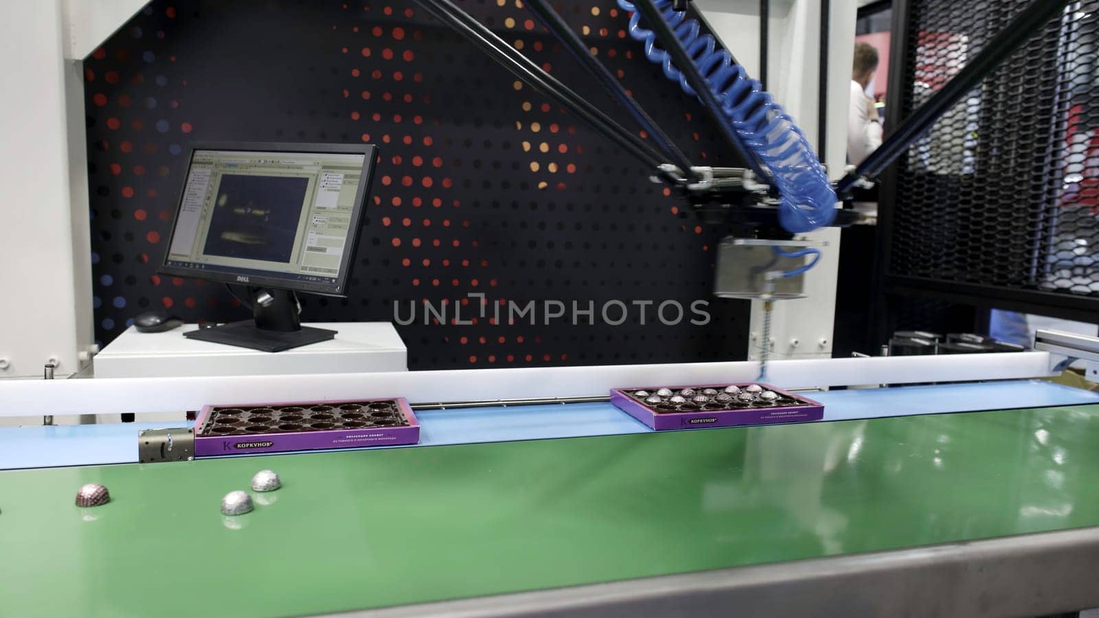 Dubai, UAE - June 2024: An advanced robotic arm operates efficiently on an assembly line, showcasing modern manufacturing technology. Media