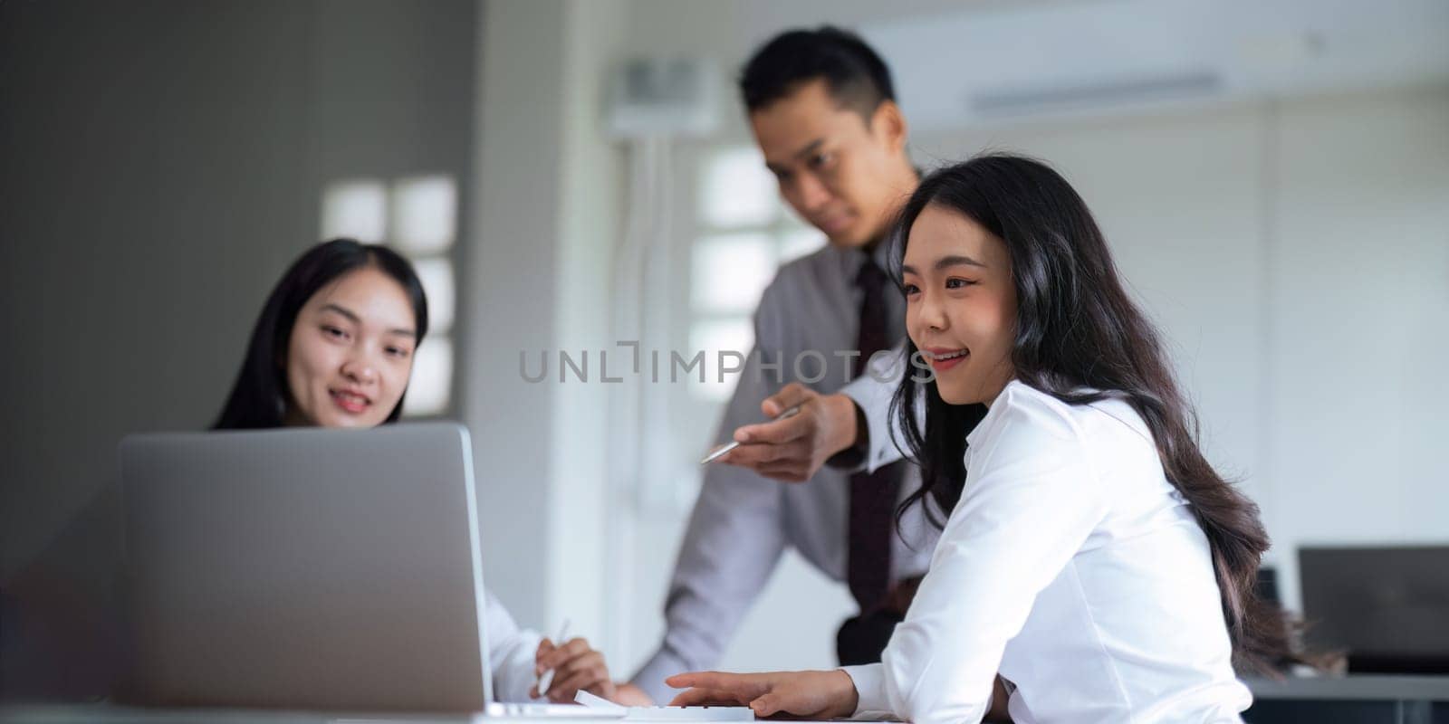 Asian business team meeting to analyze and discuss the situation on the financial report in the meeting room. Investment Consultant, Financial advisor and accounting concept.