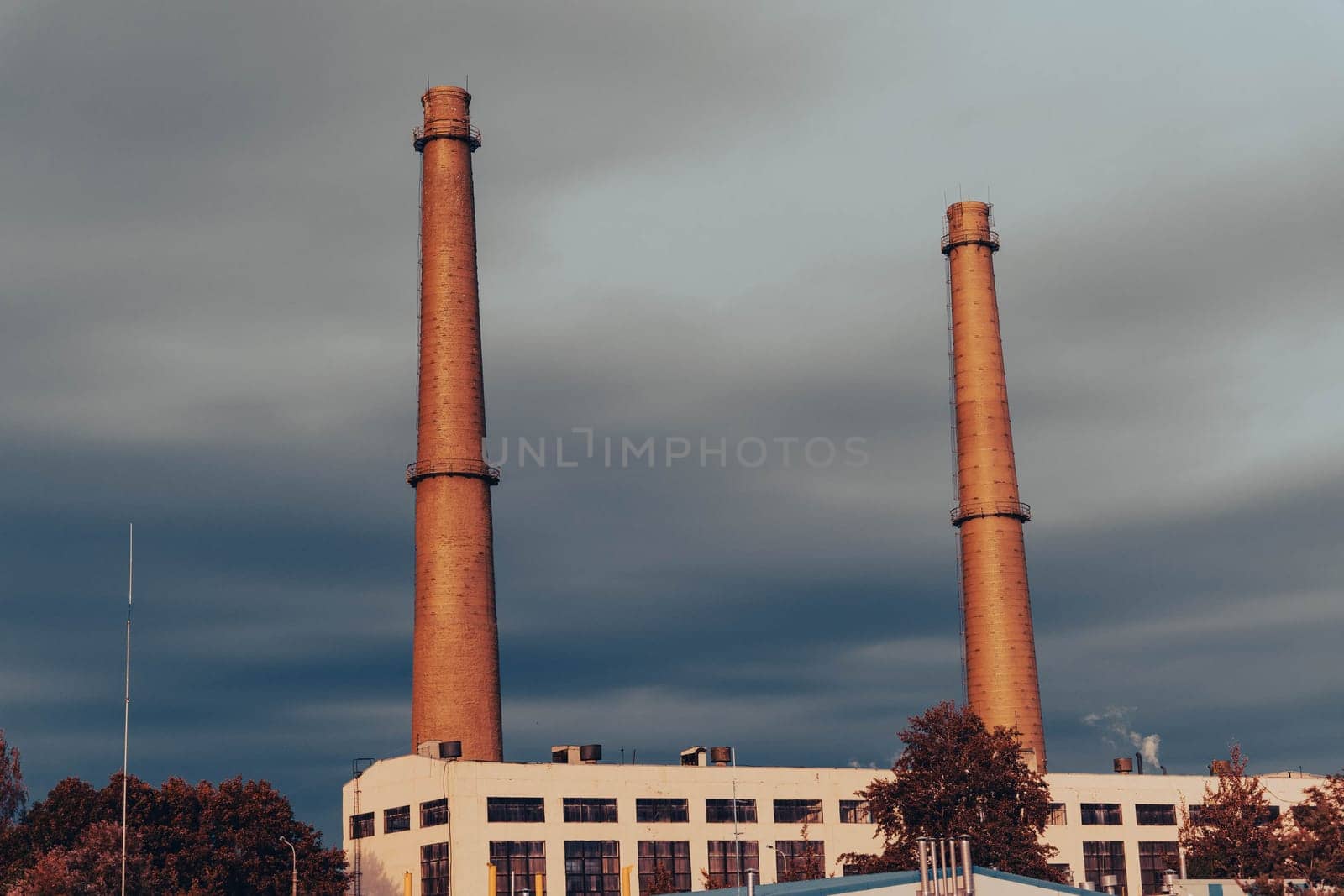 The pipes of the plant and the industrial old factory building by audiznam2609