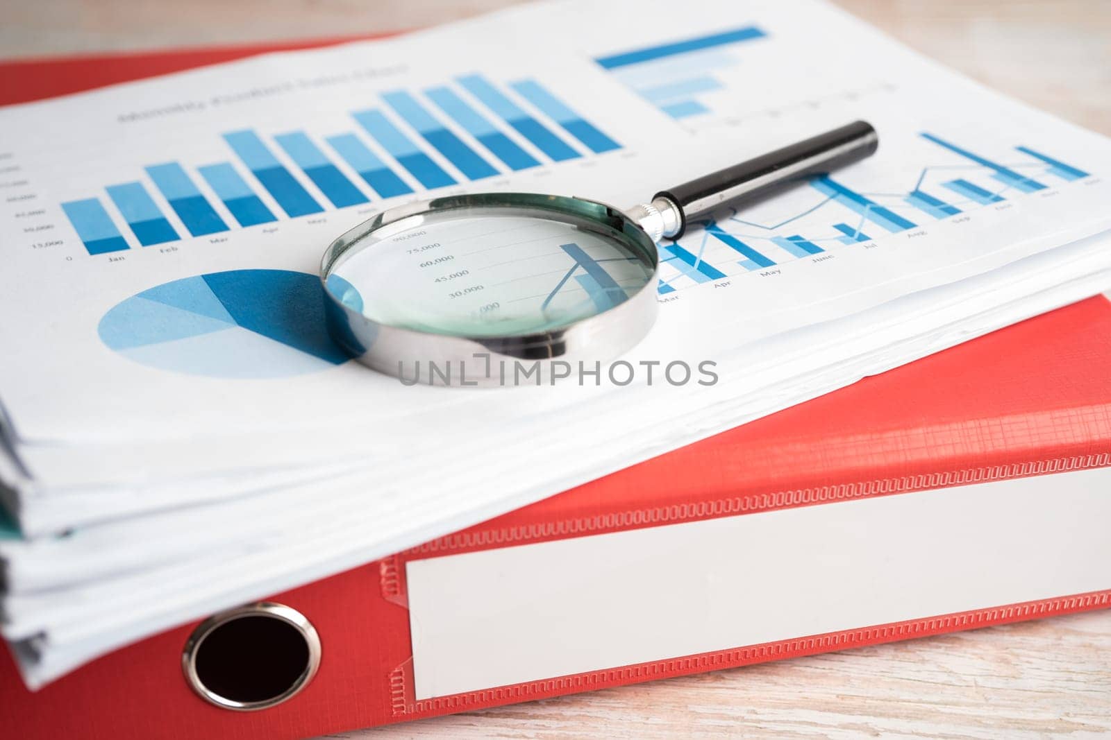 Binder with graph data finance report business with graph analysis in office.