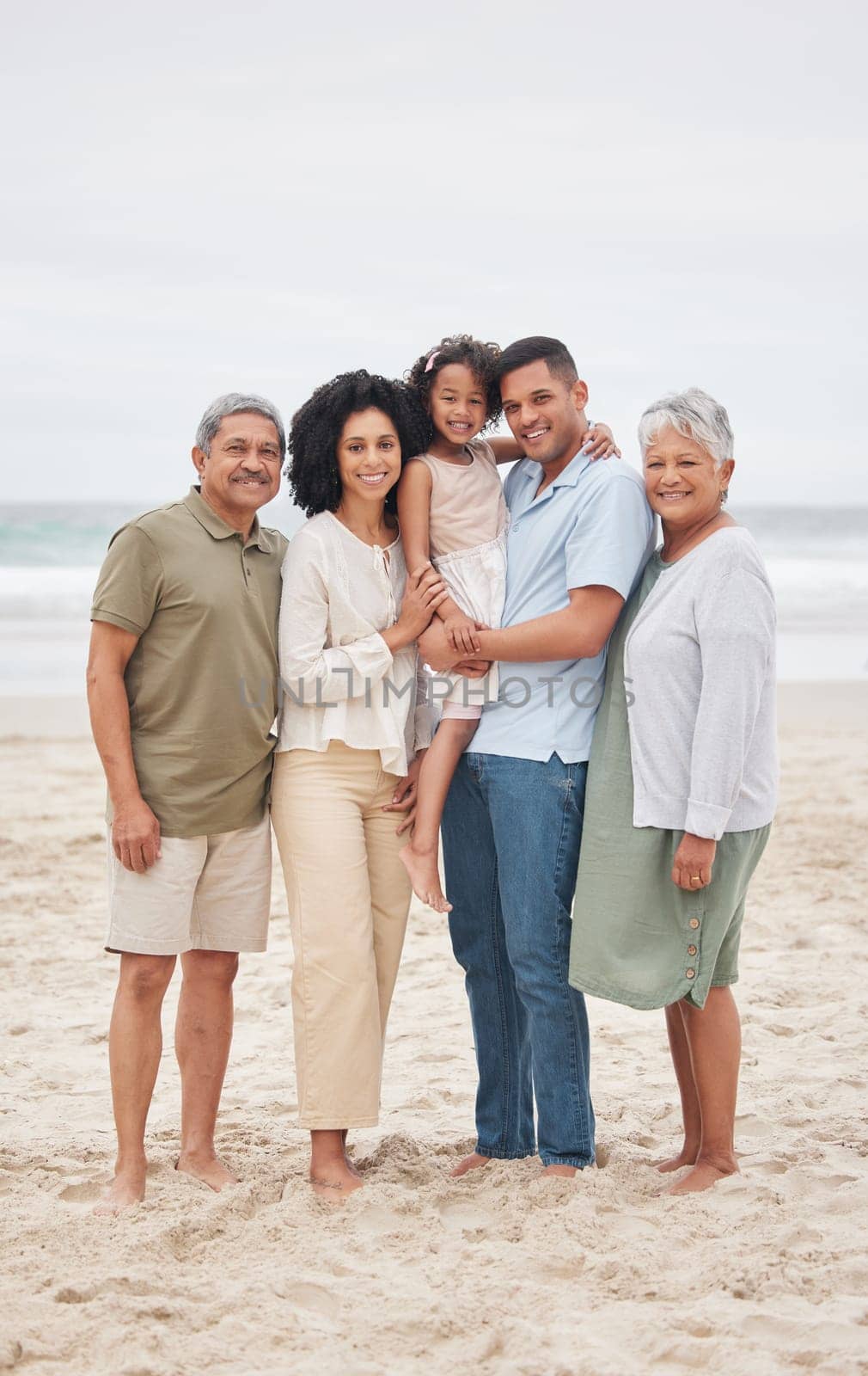 Portrait, happy and big family at beach outdoor on holiday, vacation and travel together. Grandparents, parents and child smile at ocean, bonding and love of father, mother and kid on mockup space by YuriArcurs