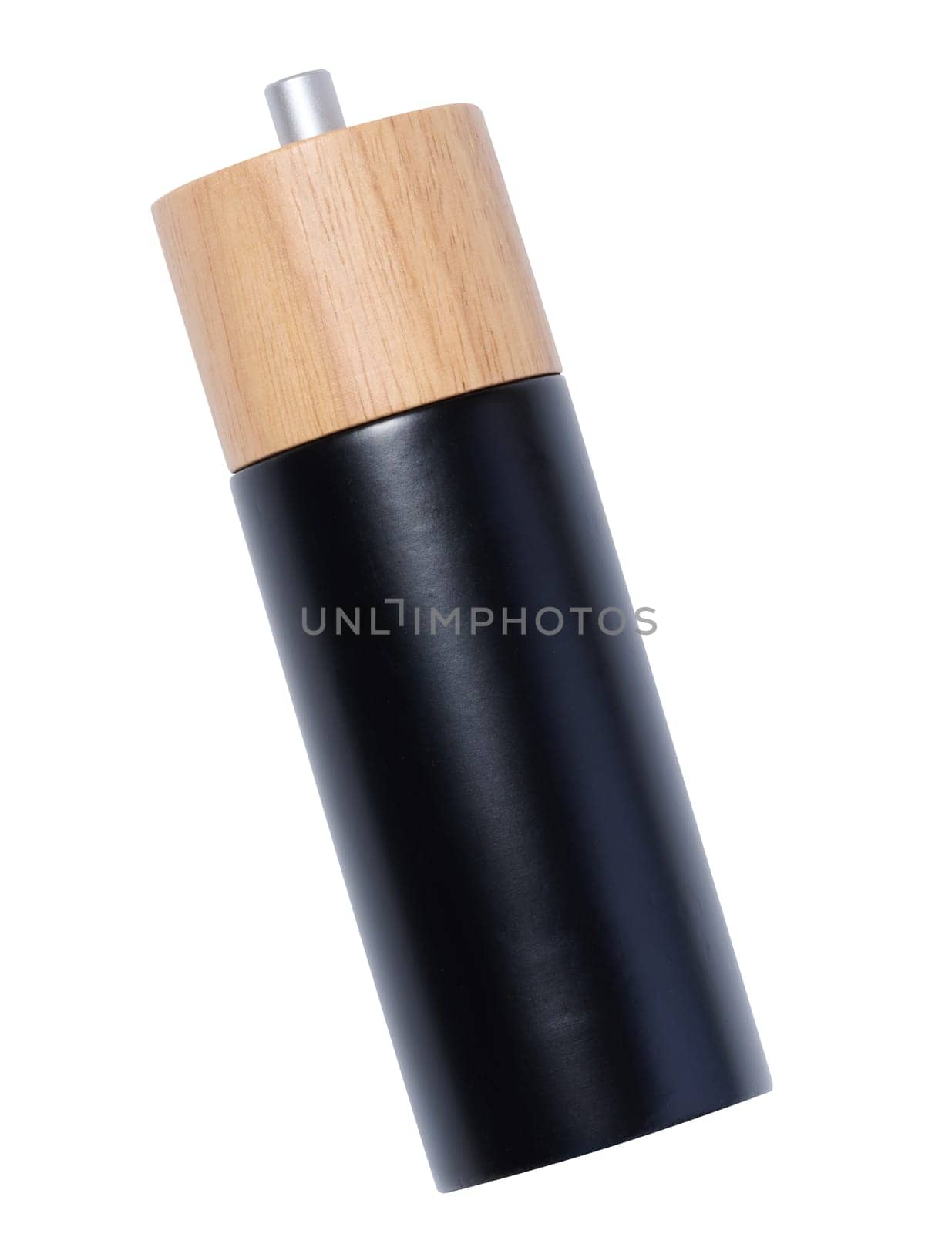 Black wooden pepper mill on a white background by ndanko