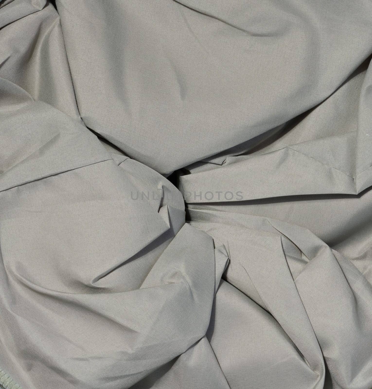 Crumpled gray fabric with creases by ndanko