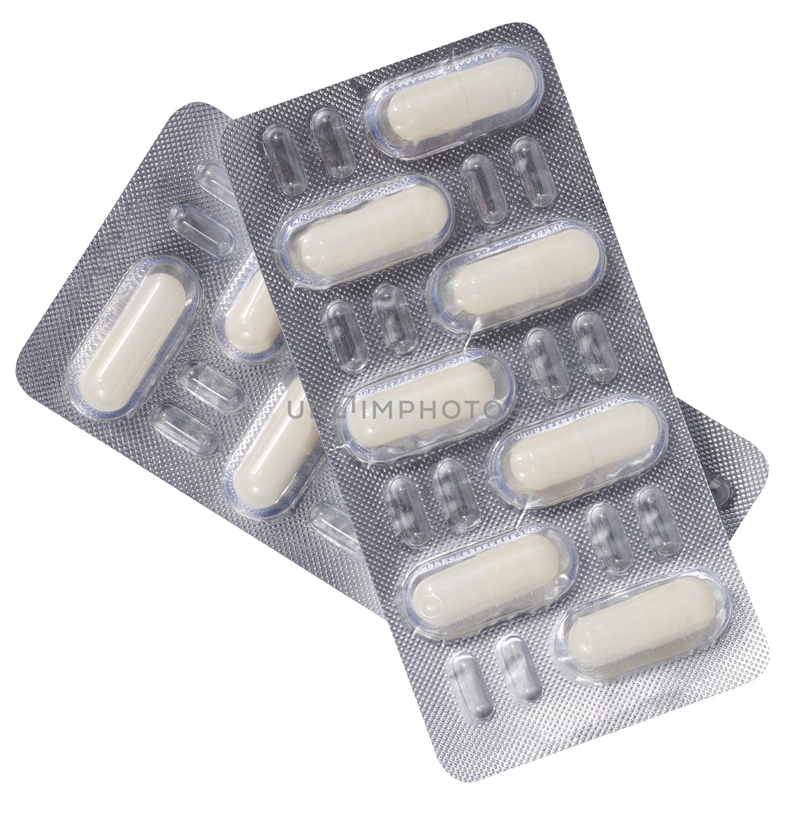 Oval white tablets in blister pack on a white isolated background, top view by ndanko