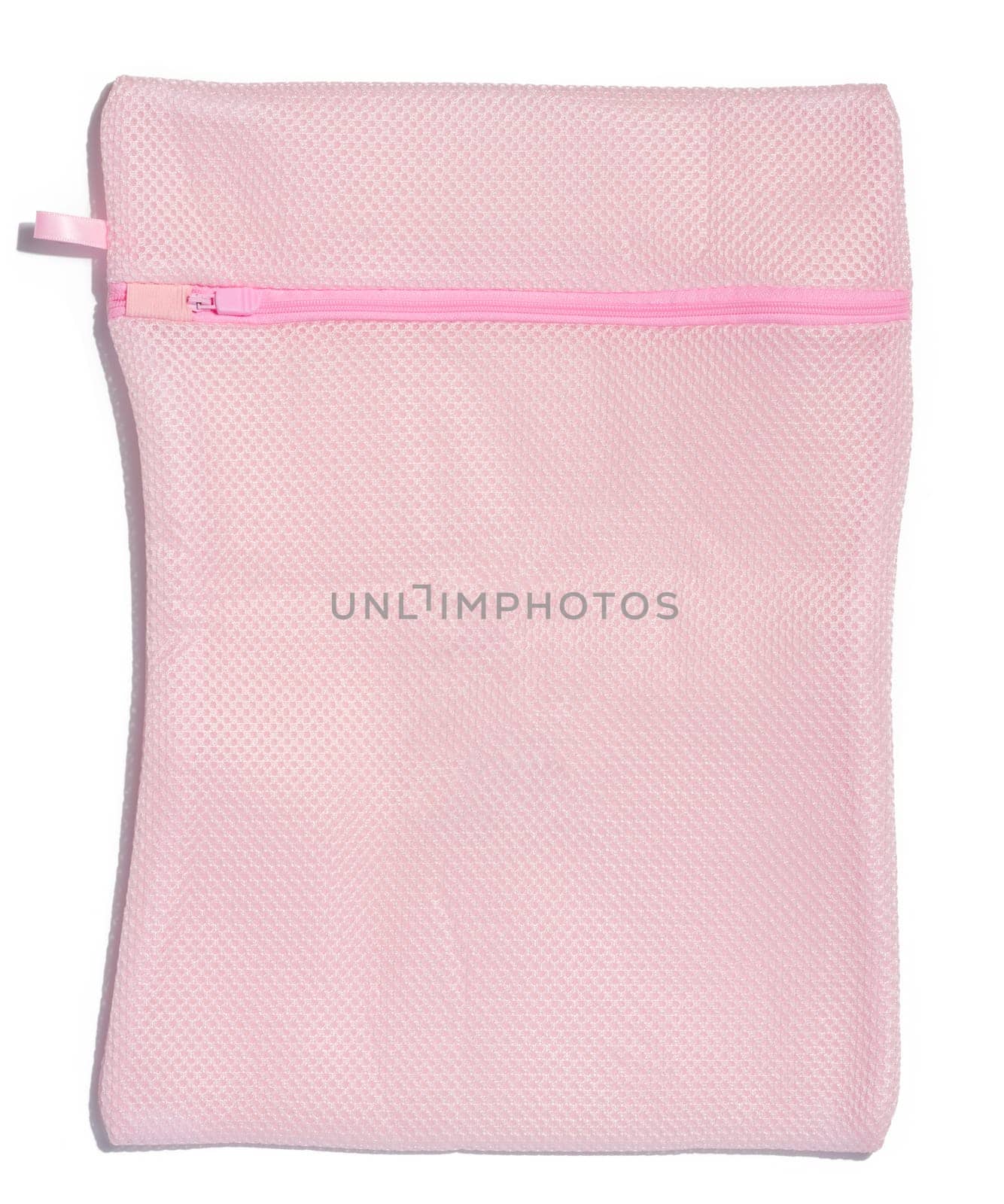 Pink bag for washing clothes in a washing machine on a white background