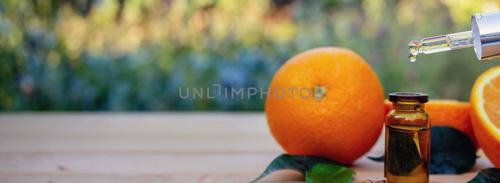 Essential extract of orange oil. Selective focus.