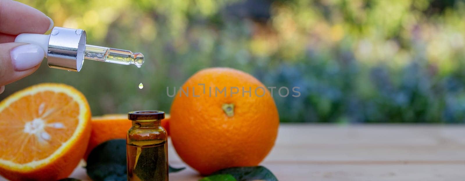 Essential extract of orange oil. Selective focus.